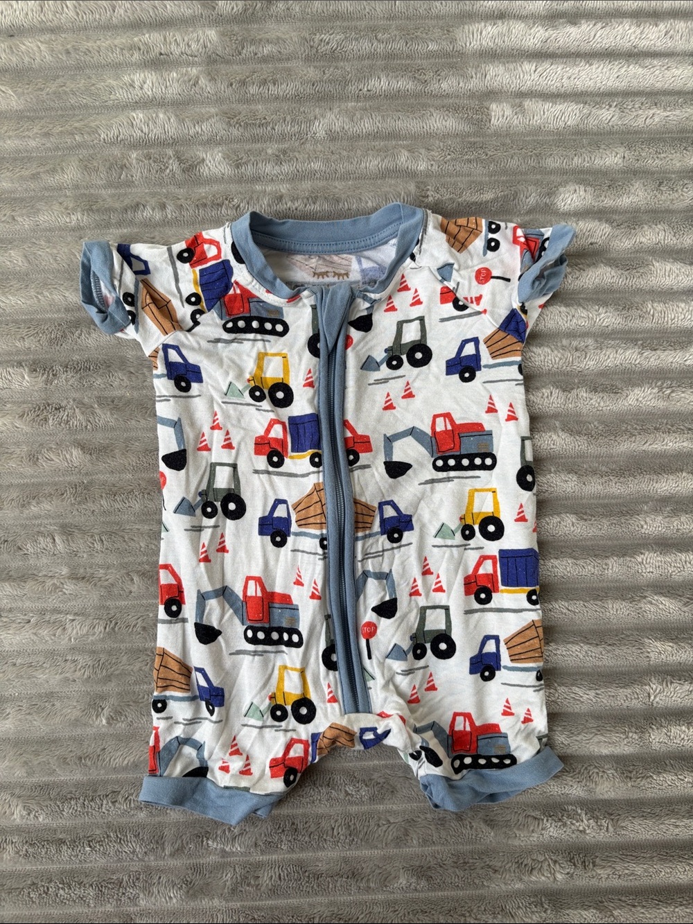 Little Sleepies White One-Piece with Red, Blue, Yellow Construction Print